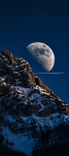 riesiger mond über schneebedeckten bergen bei nacht als mond hintergrundbilder und kostenlose handy hintergrundbilder 4k für iphone und samsung.